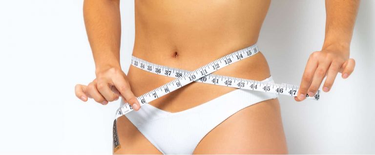 A woman with a slim waist after a tummy tuck
