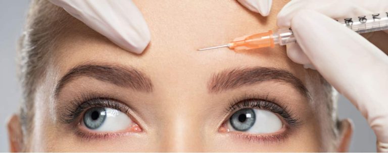 A woman getting botulinum toxin injections to reduce forehead wrinkles