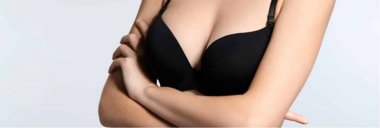 A woman whose uneven breasts were corrected with plastic surgery