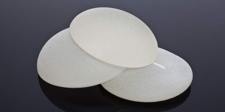 Silicone breast implants on a black background