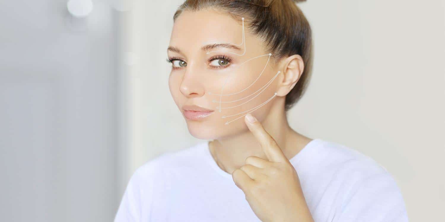 woman viewing her facial non surgical procedure at hess sandeen & lee